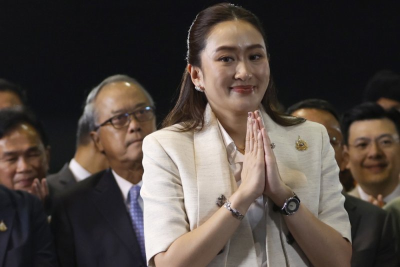 Thailand's newly elected Prime Minister Paetongtarn Shinawatra greets after winning the parliamentary vote to become a prime minister at the Pheu Thai Party's headquarters in Bangkok, Thailand, August 16, 2024. The ruling Pheu Thai Party's leader Paetongtarn Shinawatra, the youngest daughter of ousted former premier Thaksin Shinawatra, succeeded in the parliamentary vote to become Thailand's 31st prime minister. EPA-EFE/RUNGROJ YONGRIT