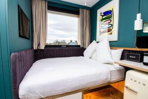 a bedroom with a bed and a window at The Devlin Dublin in Dublin