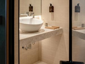 a bathroom with a bowl sink on a counter at Wren Urban Nest in Dublin