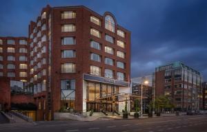 a tall brick building on a city street at Conrad Dublin in Dublin