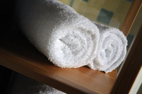 a stack of white towels sitting on a table at The Lamb Inn in Eastbourne