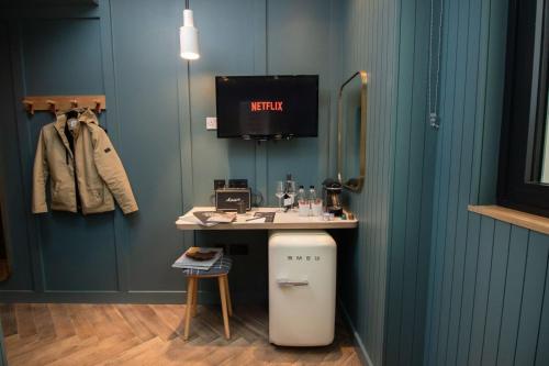 a bathroom with a vanity with a sink and a mirror at The Devlin Dublin in Dublin