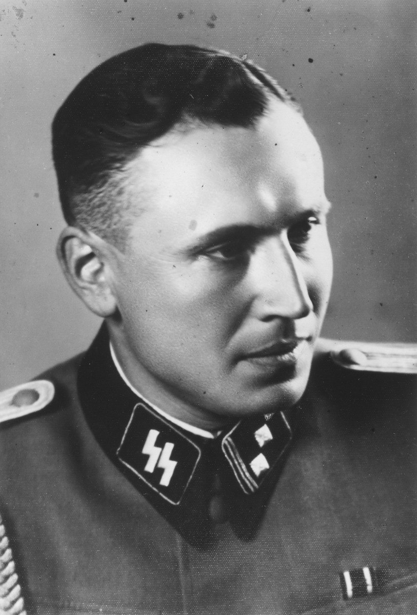 Studio portrait of Karl Hoecker. 

The original caption reads "As SS Obersturmfuehrer 21.6.44"