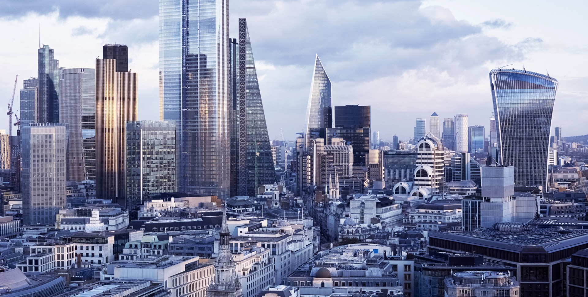 UK, London, city skyline financial district including The Scalpel, Cheesegrater (122 Leadenhall Street) Heron Tower, Walkie Talkie (20 Fenchurch Street), Tower 42, 100 Bishopsgate, 22 Bishopsgate at sunset.