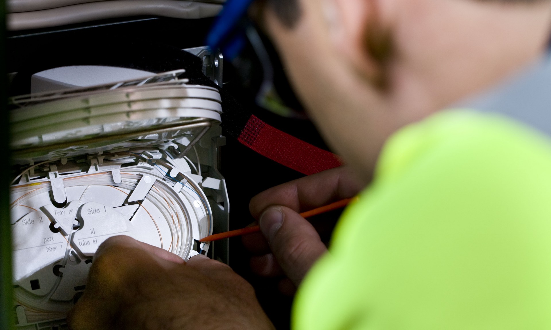 Engineer installing fibre