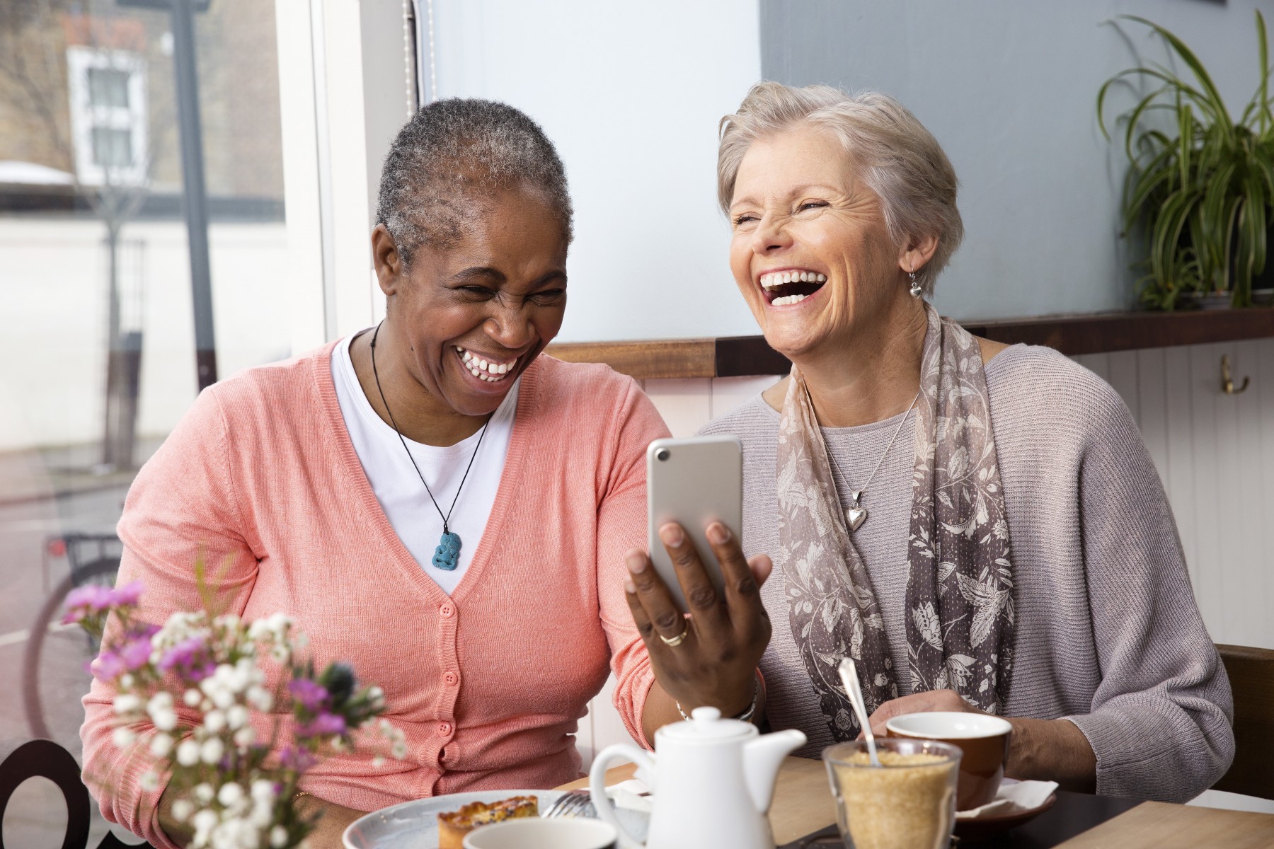Two elderly ladies in cafe