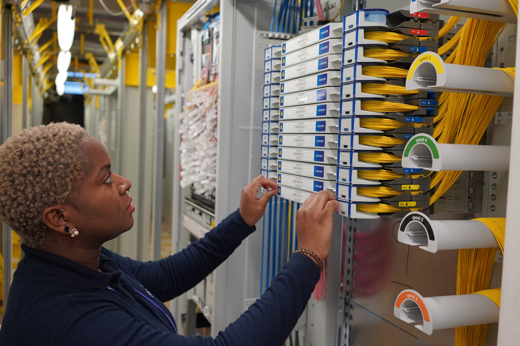 Openreach engineer works on the new full fibre network at an exchange