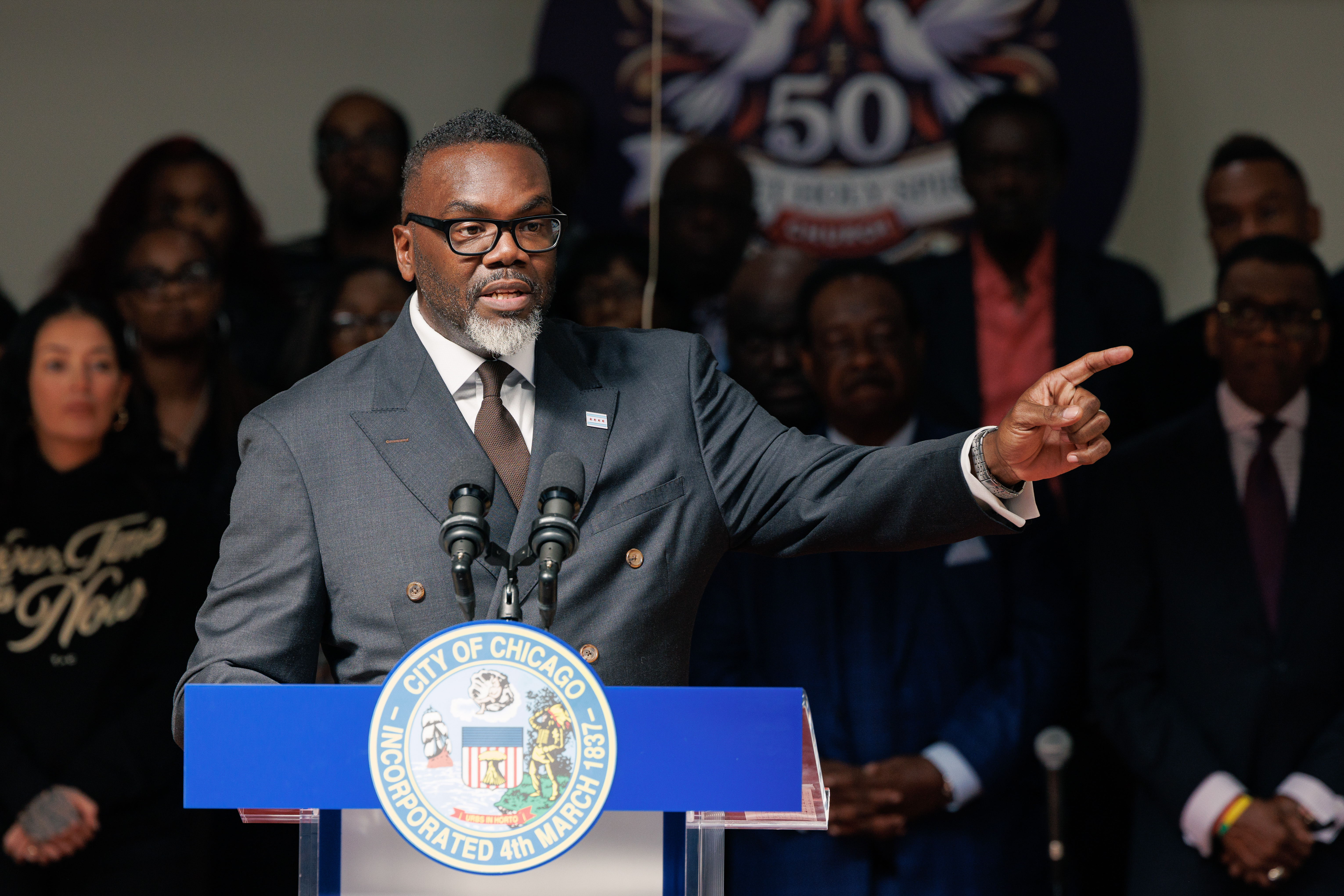 Mayor Brandon Johnson introduces his picks for School Board at the Sweet Holy Spirit Church In South Chicago on Monday. He has had harsh words for Springfield lawmakers.