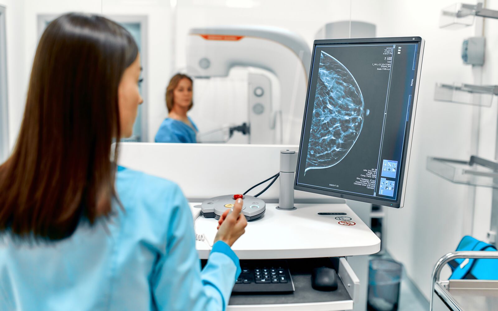 In the hospital, the patient undergoes a screening procedure for a mammogram, which is performed by a mammogram. A modern technologically advanced clinic with professional doctors.