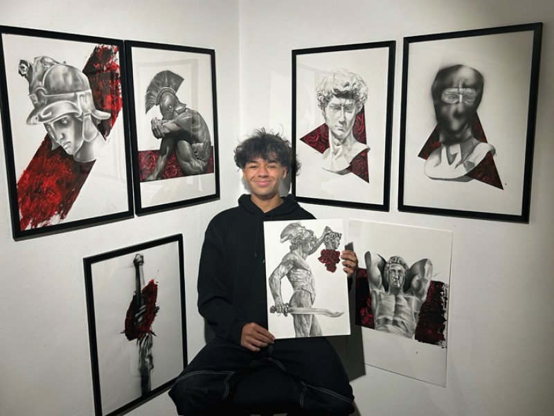 Artist Layton Hylton with his work