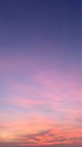 Sunset sky with pastel clouds shifting from pink to purple and blue | App Background Maker