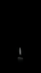 Candlelight bathes the dark in tranquil thoughtful aura | App Background Maker