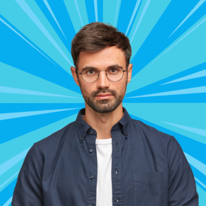 Stylish bespectacled young man confidently posing against a unique blue burst backdrop | Dp Maker