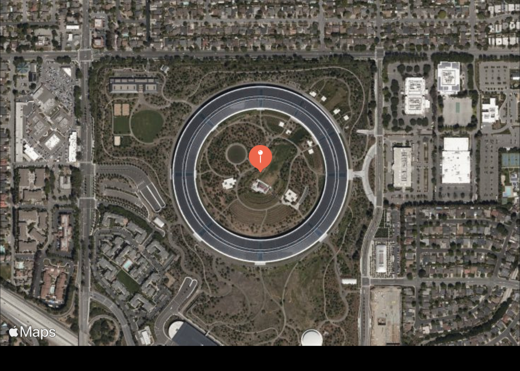 An image of a satellite view of Apple Park.