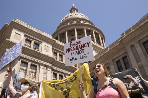 FILE - Claire Fritz rallies for abortion rights at the Capitol, in Austin, Texas, May 14, 2022. A new study released by Johns Hopkins University on Monday, June 24, 2024, shows the infant death rate in Texas went up in the wake of the state's abortion ban. ( Jay Janner/Austin American-Statesman via AP, File)