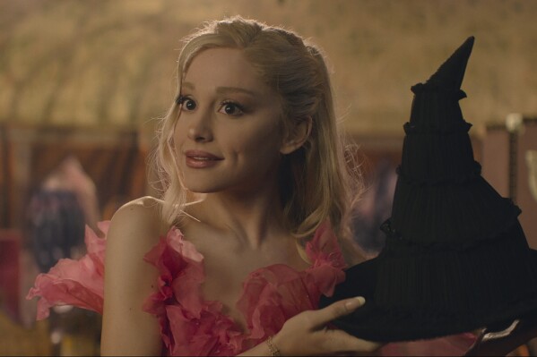 This image released by Universal Pictures shows Ariana Granda as Glinda in the film "Wicked." (Universal Pictures via AP)