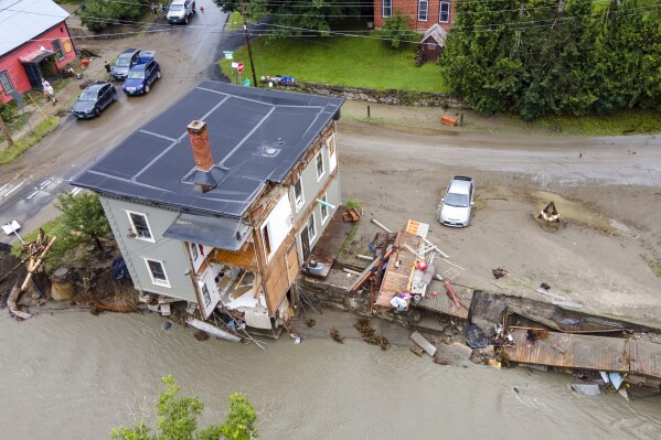 FILE - The remains of an eight unit apartment building that locals call the Heartbreak Hotel are in Plainfield, Vermont, on July 12, 2024, after flood waters and debris caused by the aftermath of Hurricane Beryl pulled several of the apartments into the Great Brook waterway. (AP Photo/Ted Shaffrey, file)