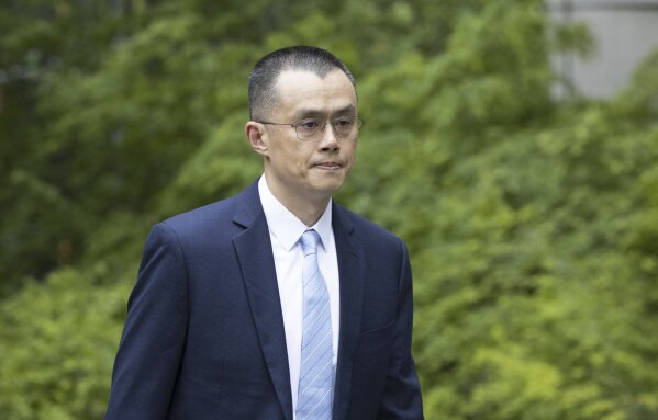 Changpeng Zhao, the founder of Binance, the world’s largest cryptocurrency exchange, enters the Federal Courthouse in Seattle Tuesday, April 30, 2024. Prosecutors are asking a judge on Tuesday to give Zhao a three-year prison term for allowing rampant money laundering on the platform. He pleaded guilty and stepped down as Binance CEO in November as the company agreed to pay $4.3 billion to settle related allegations. (Ellen M. Banner /The Seattle Times via AP)