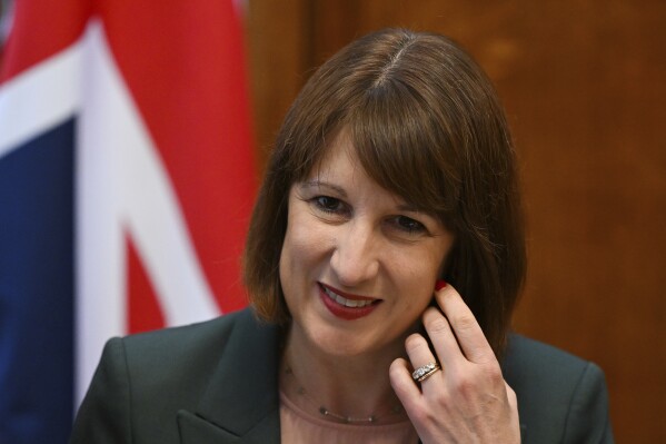 Britain's Chancellor of the Exchequer Rachel Reeves cheers a meeting of the National Wealth Fund Taskforce at 11 Downing Street in London, Tuesday, July 9, 2024. (Justin Tallis/Pool Photo via AP)