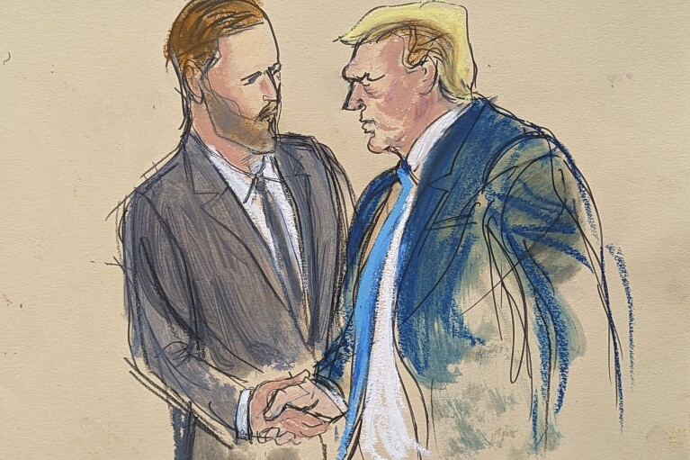 Former President Donald Trump, right, shakes his son Eric Trump's hand as he walks out of the courtroom in Manhattan Criminal Court, Thursday, May 30, 2024, in New York. Donald Trump became the first former president to be convicted of felony crimes as a New York jury found him guilty of 34 felony counts of falsifying business records in a scheme to illegally influence the 2016 election through hush money payments to a porn actor who said the two had sex. (Elizabeth Williams via AP)