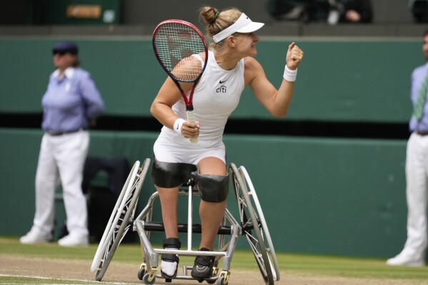 Diede De Groot of the Netherlands celebrates after defeating compatriot Aniek Van Koot in the women's wheelchair final at the Wimbledon tennis championships in London, Saturday, July 13, 2024. (AP Photo/Mosa'ab Elshamy)