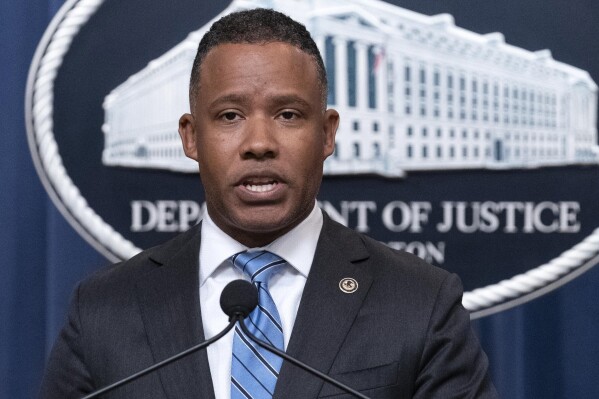 FILE - Assistant Attorney General Kenneth A. Polite, Jr. of the Justice Department's Criminal Division speaks during a news conference at the Department of Justice in Washington, Sept. 13, 2022. The head of the Justice Department’s criminal division is leaving at the end of July after two years of overseeing work that ranges from corporate fraud prosecution to war crimes investigations. Polite's tenure has included work to combat human smuggling, prosecute white-collar crime and pursue accountability for Russian war crimes in Ukraine, Attorney General Merrick Garland said in a statement. (AP Photo/Jose Luis Magana, File)