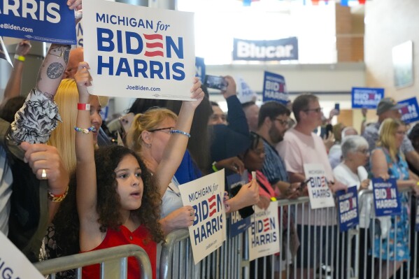 Supporters of President Joe Biden wait for his arrival as they wait for his to speak at Renaissance High School, Friday, July 12, 2024, during a campaign event in Detroit. (AP Photo/Jacquelyn Martin)