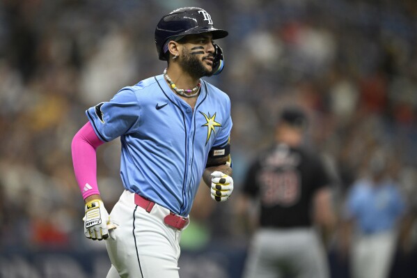 Tampa Bay Rays' Jose Siri rounds first base after hitting a solo home run during the third inning of a baseball game against the Cleveland Guardians, Sunday, July 14, 2024, in St. Petersburg, Fla. (AP Photo/Phelan M. Ebenhack)