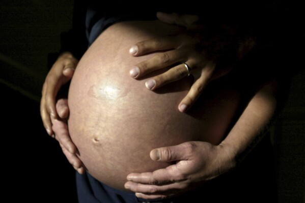 This Nov. 2005 file photo shows future parents awaiting the arrival of their first child in Carlsbad, Calif. When you're expecting a baby, you hope nothing goes wrong. But at least one in 20 pregnant patients develops a scary complication called preeclampsia, a high blood pressure disorder that kills 70,000 women and 500,000 babies worldwide every year. New blood tests promise to help doctors predict and manage the condition. (AP Photo/Julie Busch, file)