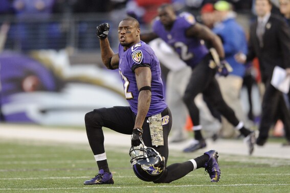 FILE - In this Nov. 10, 2013 file photo, Baltimore Ravens wide receiver Jacoby Jones cheers in overtime of an NFL football game against the Cincinnati Bengals in Baltimore. The Houston Texans, Jones' team for the first five seasons of his career, announced his death Sunday, July 14, 2024. He was 40. (AP Photo/Nick Wass, File)