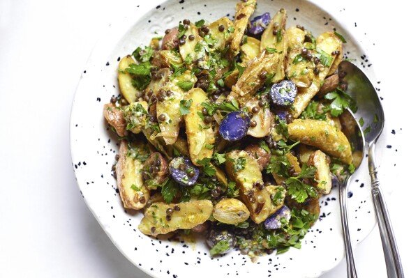 This image shows a recipe for potato salad with leeks, lentils and a citrus vinaigrette. (Patricia Bannan via AP)