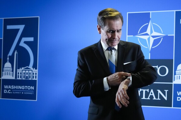 National Security Council spokesman John Kirby checks his wristwatch in between his interviews at the media center at the NATO Summit in Washington, Thursday, July 11, 2024. (Photo/Pablo Martinez Monsivais)