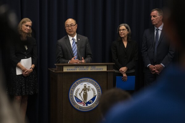 Ramsey County Attorney John Choi, at podium, discusses his office's review of former Ramsey County Medical Examiner Michael McGee's work during a news conference in St. Paul, Minn. on Wednesday, Sept. 11, 2024.(John Autey/Pioneer Press via AP)