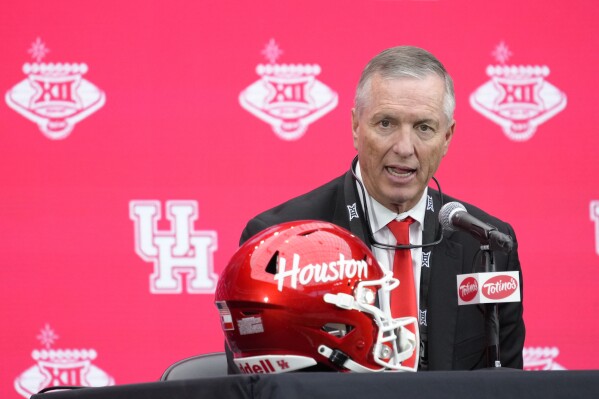 FILE - Houston head coach Willie Fritz speaks during the Big 12 Conference NCAA college football media days in Las Vegas, Wednesday, July 10, 2024. (AP Photo/Lucas Peltier, File)