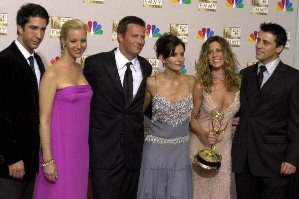 FILE - David Schwimmer, Lisa Kudrow, Matthew Perry, Courteney Cox, Jennifer Aniston and Matt LeBlanc pose after "Friends" won outstanding comedy series at the 54th Primetime Emmy Awards Sept. 22, 2002, in Los Angeles. Perry, who starred as Chandler Bing has died. The actor was found dead of an apparent drowning at his Los Angeles home on Saturday, according to the Los Angeles Times and celebrity website TMZ, which was the first to report the news. Both outlets cited unnamed sources confirming Perry’s death. His publicists and other representatives did not immediately return messages seeking comment. (AP Photo/Reed Saxon, File)