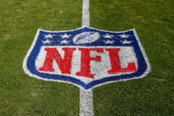 FILE - The NFL logo is displayed on the field at the Bank of American Stadium, Nov. 4, 2018, in Charlotte, N.C. The judge who presided in the class-action lawsuit filed by “Sunday Ticket” subscribers against the NFL said the jury did not follow his instructions in determining damages. (AP Photo/Nell Redmond, File)