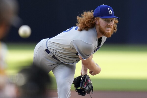 FILE - Los Angeles Dodgers starting pitcher Dustin May works against a San Diego Padres batter during the first inning of a baseball game, May 6, 2023, in San Diego. May had esophagus surgery and won't return this season, another setback for him and the team’s banged-up pitching staff. May needed the procedure to repair a tear after he experienced discomfort following a dinner earlier in the week, the Dodgers confirmed Sunday, July 14, 2024. (AP Photo/Gregory Bull, File)