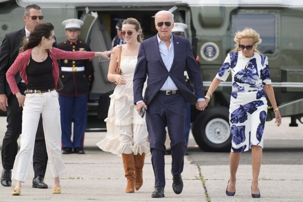 President Joe Biden, center right, and first lady Jill Biden, right, arrive on Marine One with granddaughters Natalie Biden, from left, and Finnegan Biden, at East Hampton Airport, Saturday, June 29, 2024, in East Hampton, N.Y. (AP Photo/Evan Vucci)