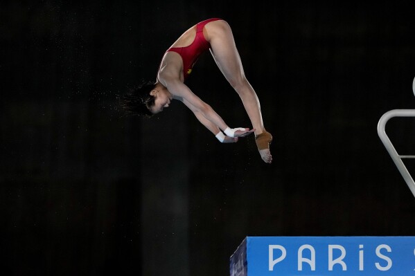 China's Quan Hongchan competes in the women's 10m platform diving final at the 2024 Summer Olympics, Tuesday, Aug. 6, 2024, in Saint-Denis, France. (AP Photo/Lee Jin-man)