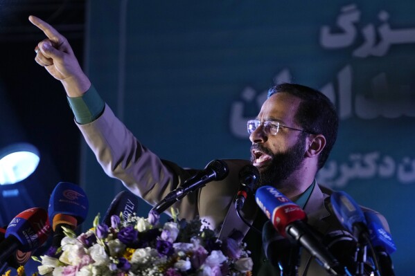 Iranian lawyer Mohsen Borhani speaks during a campaign rally of the reformist candidate for the presidential election Masoud Pezeshkian, in Tehran, Iran, Wednesday, July 3, 2024. Borhani, an outspoken lawyer who has publicly criticized how the government handled the 2022 protests has been arrested, state media reported Sunday. The arrest came a day after reformist president Masoud Pezeshkian was elected to lead the country. (AP Photo/Vahid Salemi)