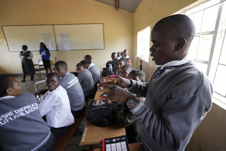 A student, who is deaf, uses sign language during a climate change lesson at Chileshe Chepela Special School in Kasama, Zambia, Wednesday, March 6, 2024. Sign language isn't recognized as an official language in Zambia, but the government has taken steps to ensure its recognition and has made it mandatory for climate change education to also be taught in sign language. (AP Photo/Tsvangirayi Mukwazhi)