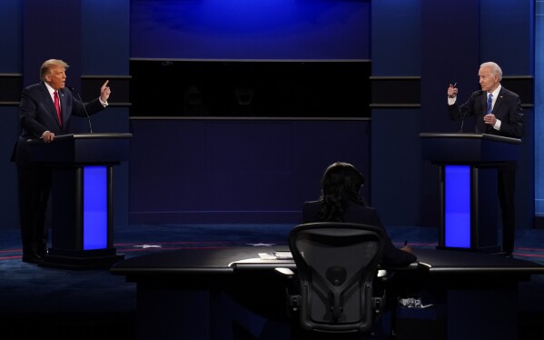 FILE - President Donald Trump, left, and Democratic presidential candidate former Vice President Joe Biden during the second and final presidential debate Oct. 22, 2020, at Belmont University in Nashville, Tenn. Unflattering portraits of both President Joe Biden and former President Donald Trump emerge clearly in a new poll by The Associated Press-NORC Center for Public Affairs Research, which asked an open-ended question about what comes to mind when people think of them. (AP Photo/Patrick Semansky, File)