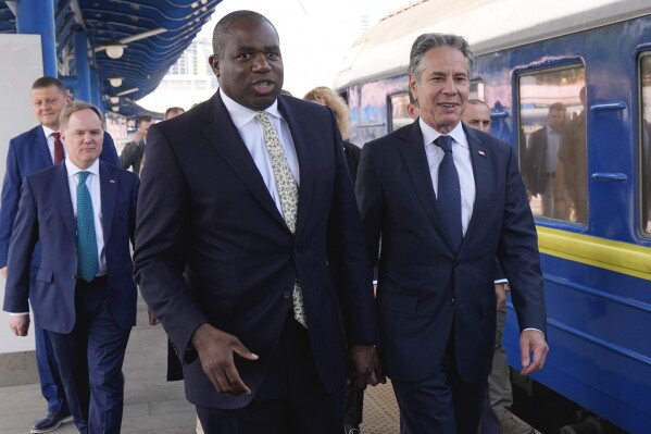 U.S. Secretary of State Antony Blinken and British Foreign Secretary David Lammy arrive at the train station in Kyiv, Ukraine, Wednesday, Sept. 11, 2024. (AP Photo/Mark Schiefelbein, Pool)