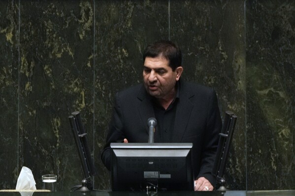 Iran's acting President Mohammad Mokhber addresses during the opening ceremony of a new parliament term, in Tehran, Iran, Monday, May 27, 2024. Mokhber addressed the country's new parliament Monday in his first public speech since last week's helicopter crash that killed his predecessor and seven others. (AP Photo/Vahid Salemi)