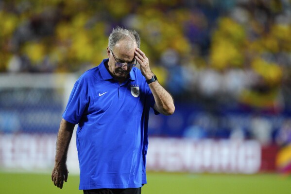 Uruguay's coach Marcelo Bielsa reacts after his team's 1-0 loss against Colombia in a Copa America semifinal soccer match in Charlotte, N.C., Wednesday, July 10, 2024. (AP Photo/Jacob Kupferman)