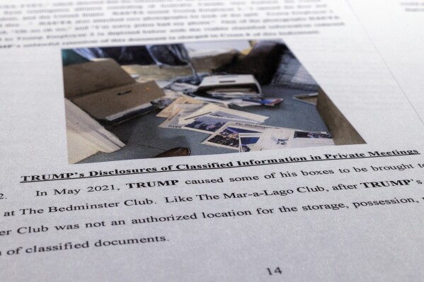 FILE - The indictment against former President Donald Trump is photographed on Friday, June 9, 2023. The federal judge presiding over the classified documents case against former President Donald Trump is hearing arguments Friday, June 21, 2024, on a long-shot defense effort to get the indictment thrown out based on the claim that the prosecutor who brought the charges was illegally appointed. (AP Photo/Jon Elswick, File)