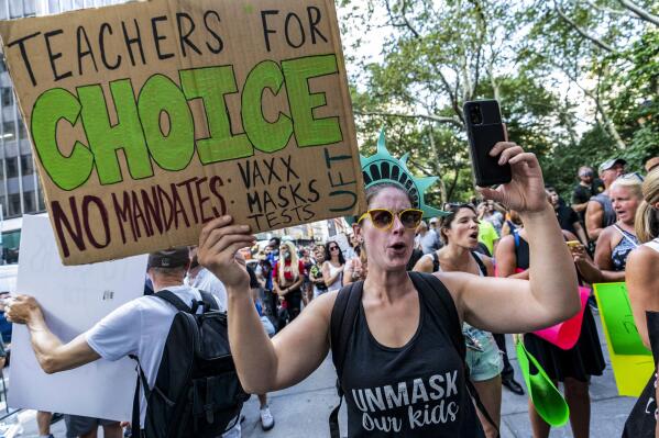 FILE - This photo from Wednesday Aug. 25, 2021, shows teachers protesting against COVID-19 vaccination mandates in New York. On Friday, Oct. 1, 2021, U.S. Supreme Court Justice Sonia Sotomayor denied an emergency appeal from a group of teachers to block New York City's COVID-19 vaccine mandate for public school teachers and other staff from going into effect. (AP Photo/Mary Altaffer, file)