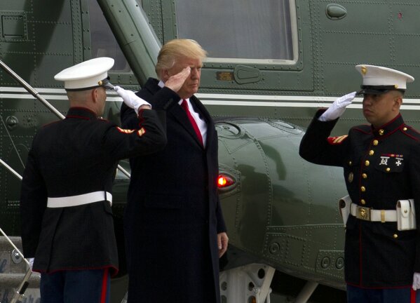 
              President Donald Trump salutes upon his arrival at Andrews Air Force Base, Md., Monday, March 20, 2017, en route to Louisville, Ky., for a rally. F.B.I. Director James Comey said Monday the F.B.I. had "no information" to support the president's allegation that Barack Obama wiretapped him. ( AP Photo/Jose Luis Magana)
            