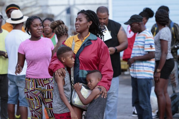 Evacuees from Union Island arrive in Kingstown, St. Vincent and the Grenadines, July 3, 2024. (AP Photo/Lucanus Ollivierre)