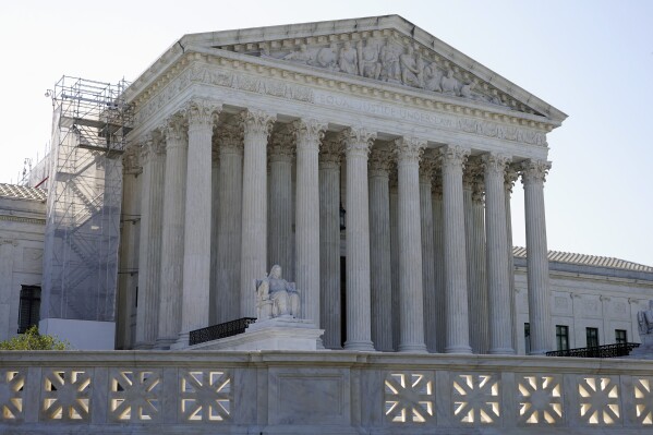 The sun rises behind the Supreme Court on Capitol Hill in Washington, Tuesday, July 11, 2023. (AP Photo/Patrick Semansky)